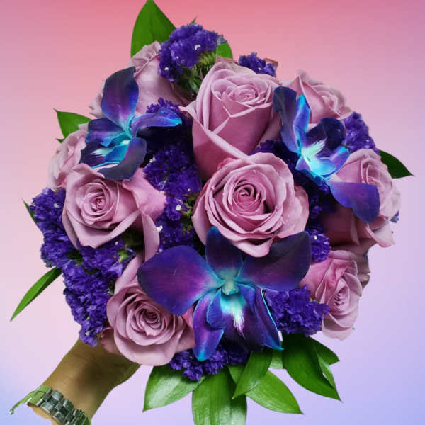 Bouquet of lavender roses with purple flowers and blue orchids