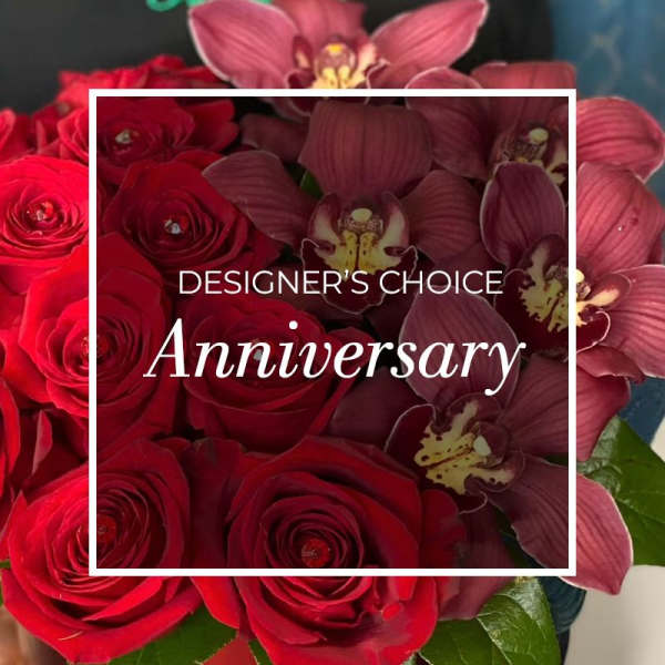 Red roses and burgundy orchids in a bouquet