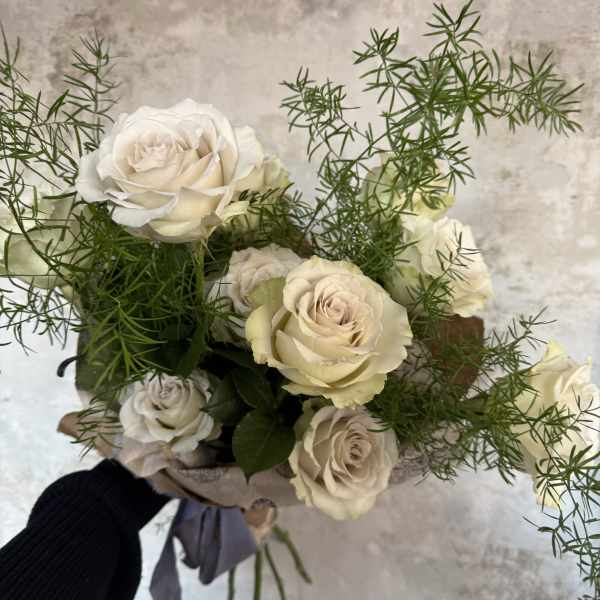 Bouquet of cream roses with airy greenery