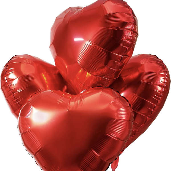 Cluster of red heart-shaped balloons on strings