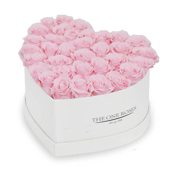 Heart-shaped box of pale pink roses