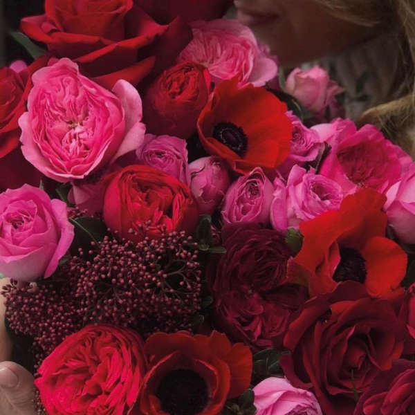 Bouquet of red and pink roses with red anemones