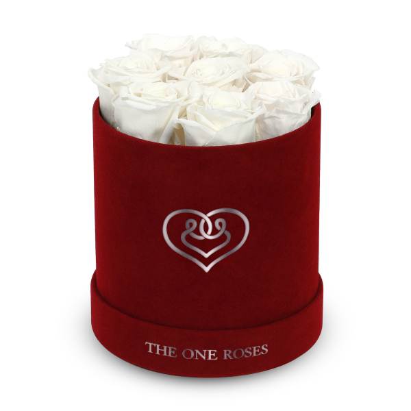 White roses in a red velvet hat box
