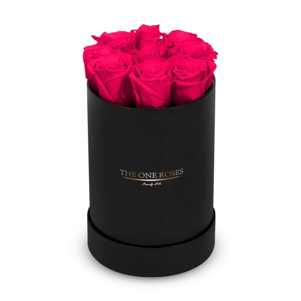 Hot pink roses in a black round box