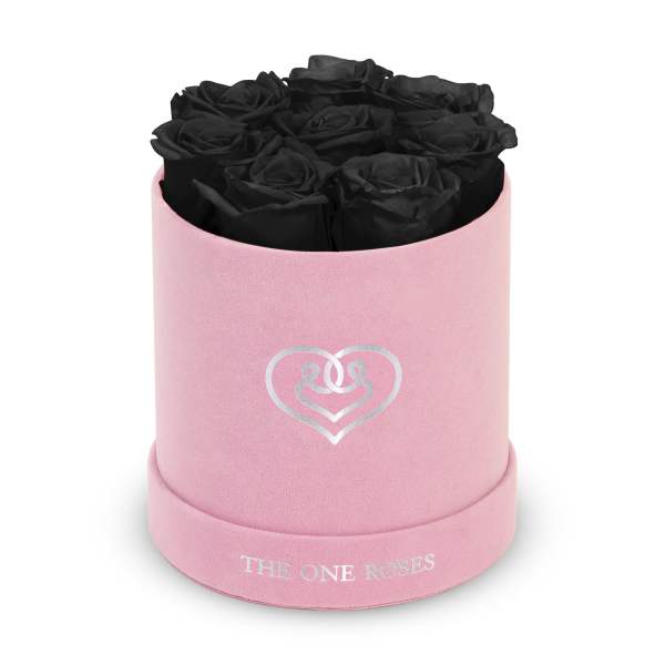 Black roses in a pink round box with a heart logo