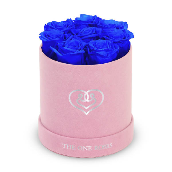 Blue roses in a pink round box with a heart logo