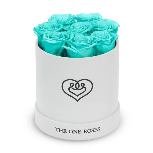 Turquoise roses in a white round box