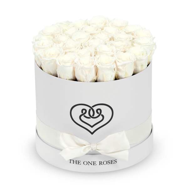 Round box of white roses with a ribbon bow