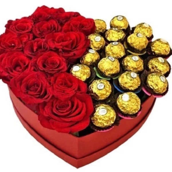 Heart-shaped box with red roses and gold-wrapped chocolates