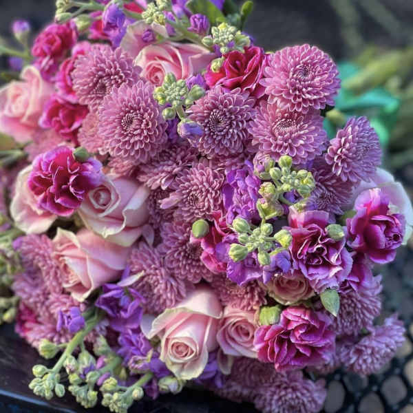 Bouquet of pink and purple roses, chrysanthemums, and carnations