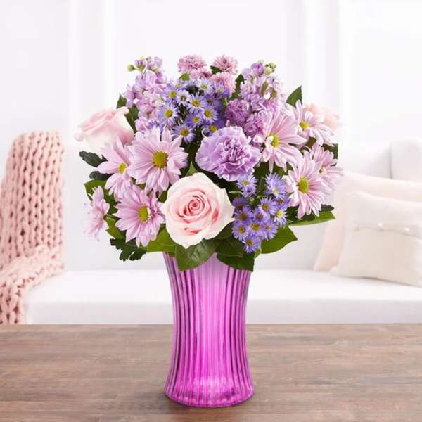 Pink and lavender mixed bouquet in a purple vase