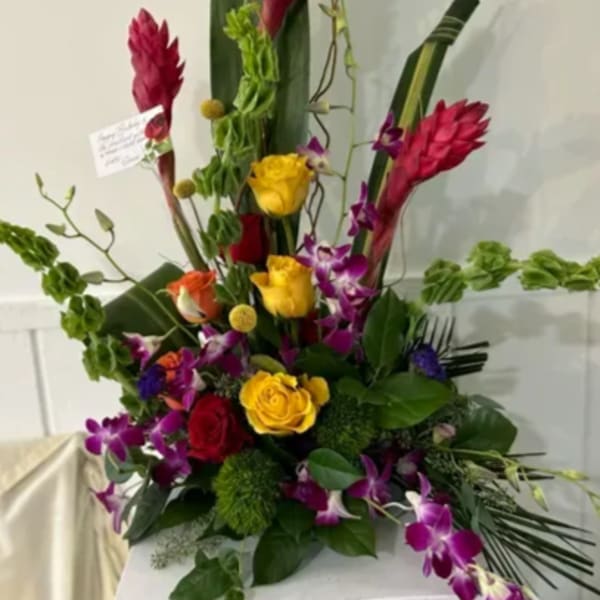 Tall tropical bouquet with red ginger, roses, and purple orchids