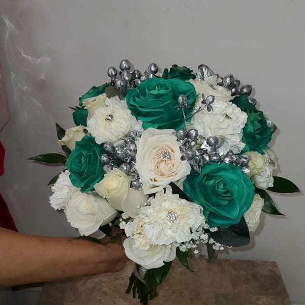Bouquet of teal and white roses with silver accents