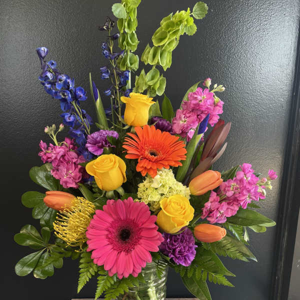 Colorful mixed bouquet in a clear glass vase