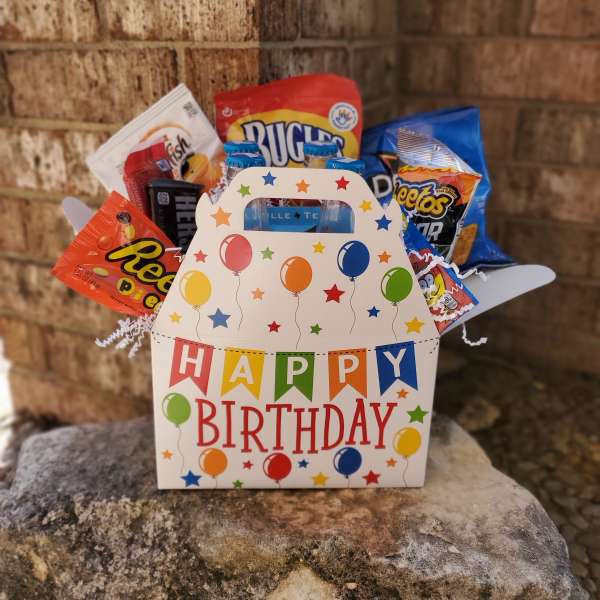 Birthday gift basket with assorted snacks in a decorated box