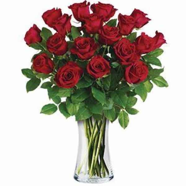 Arrangement of red roses in a clear glass vase