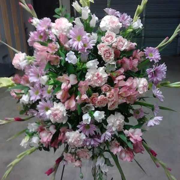 Large pastel floral spray with pink, white, and lavender blooms