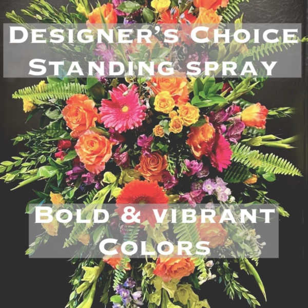 Tall standing spray with orange, pink, yellow, and purple flowers