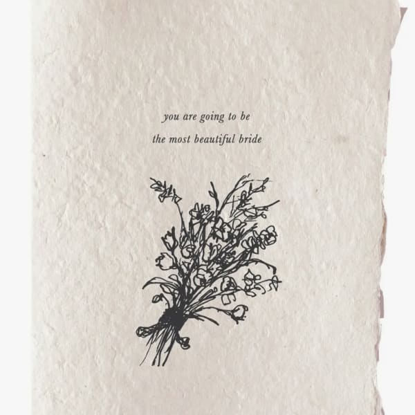 Cream card with the words "you are going to be the most beautiful bride" and a floral sketch