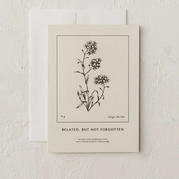 A botanical card with a black line drawing of forget-me-nots