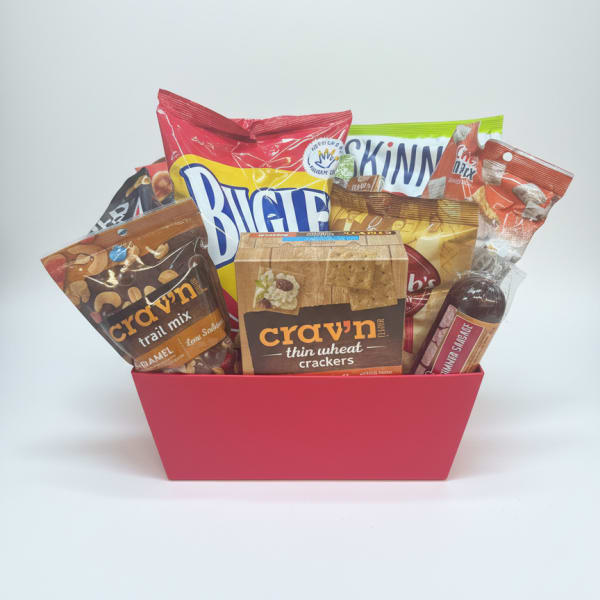 Gift basket with assorted snack packages in a pink container
