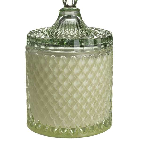 Green glass jar candle with a faceted lid