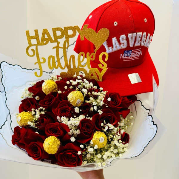 Bouquet of red roses with gold-wrapped chocolates and a red cap