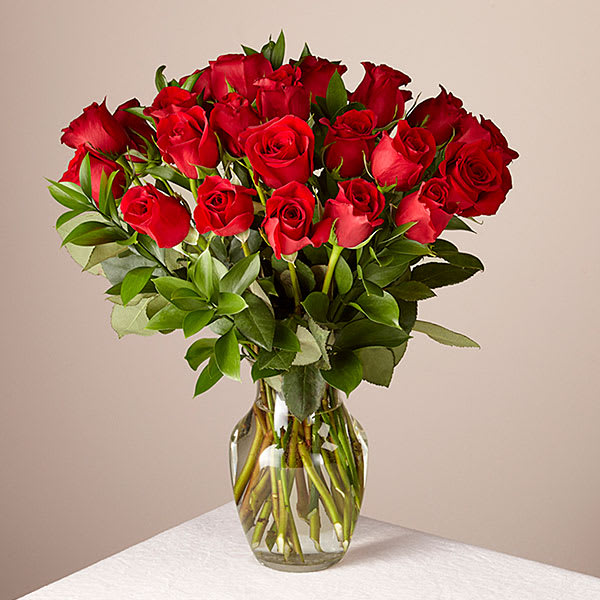 Bouquet of red roses in a clear glass vase