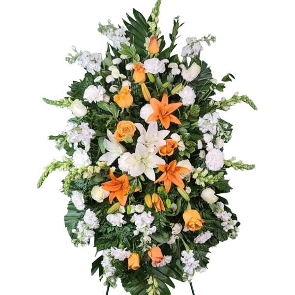 Standing floral spray with orange and white flowers on a white background