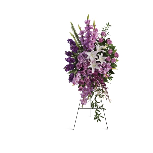 Tall purple and white floral standing spray on an easel