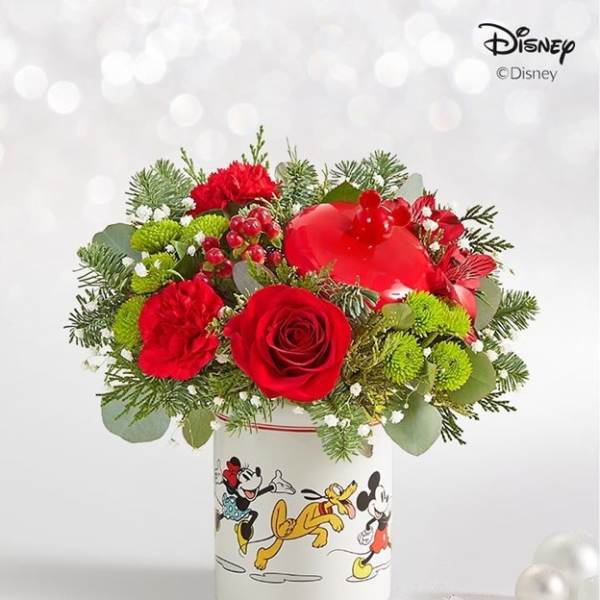 Red roses and carnations in a Disney-printed vase