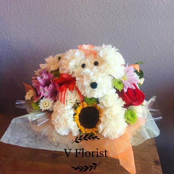 Bouquet shaped like a teddy bear made from white and pink flowers