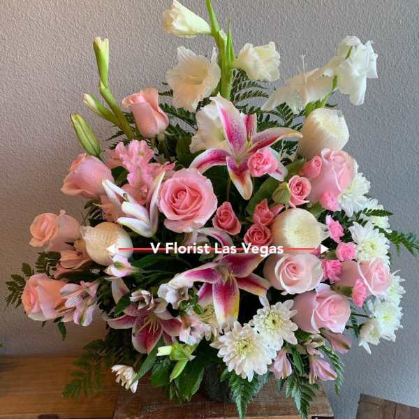 Pink and white mixed bouquet with roses, lilies, and daisies