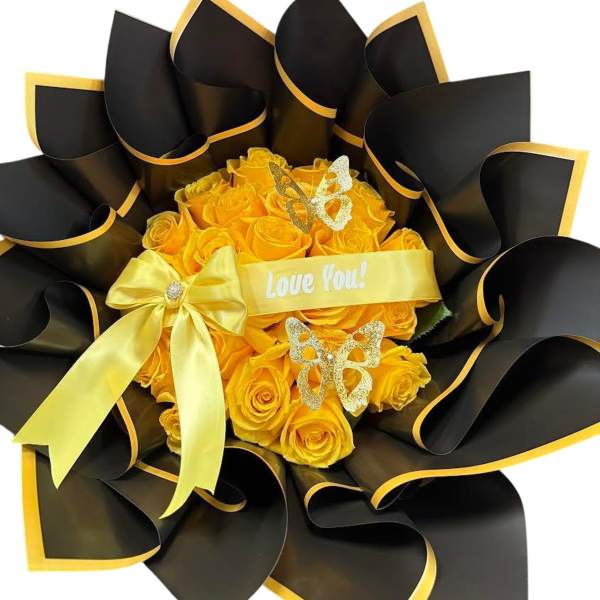 Yellow rose bouquet wrapped in black paper with a ribbon and butterfly decorations