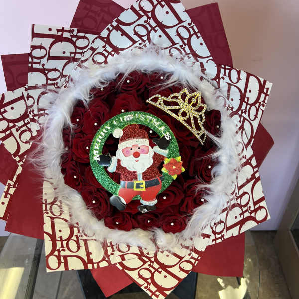 Red rose bouquet with Santa decoration and white feather trim