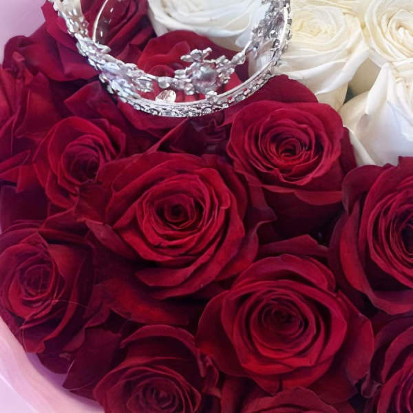 Bouquet of red and white roses with a jeweled crown