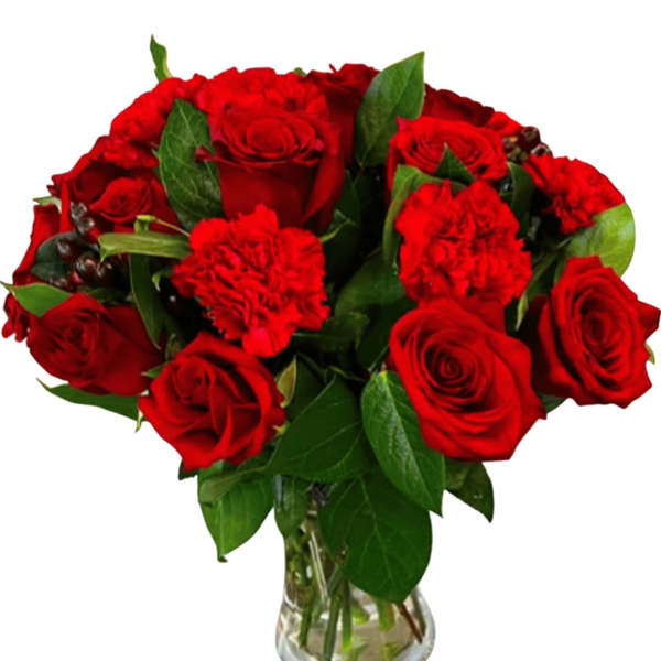 Red roses and carnations in a clear glass vase