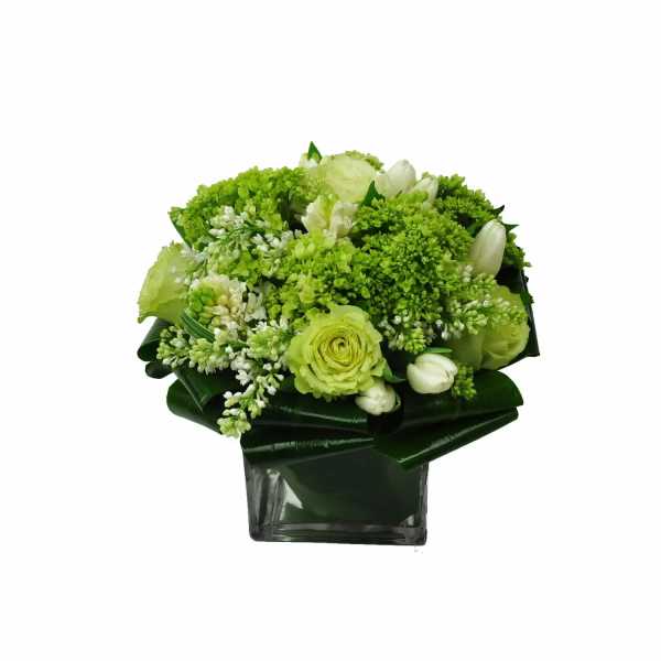 Green and white bouquet in a square glass vase