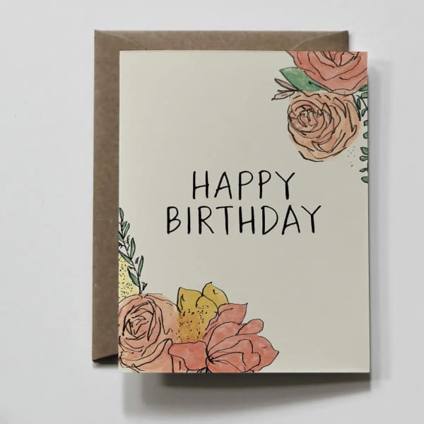 Birthday card with floral illustrations and a kraft envelope