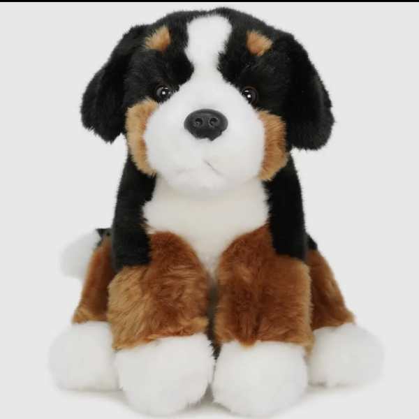 Plush stuffed dog toy with black, white, and brown fur