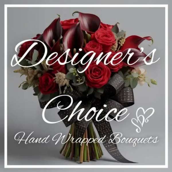 Hand-wrapped bouquet of red roses and dark calla lilies with a black ribbon