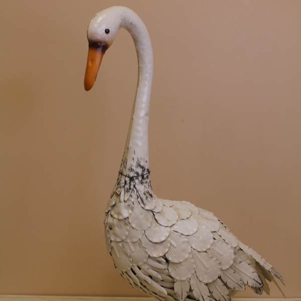 Decorative white swan figurine with orange beak and feet