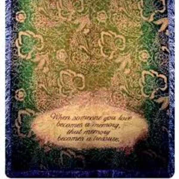 Decorative memorial plaque with a floral border and a quote