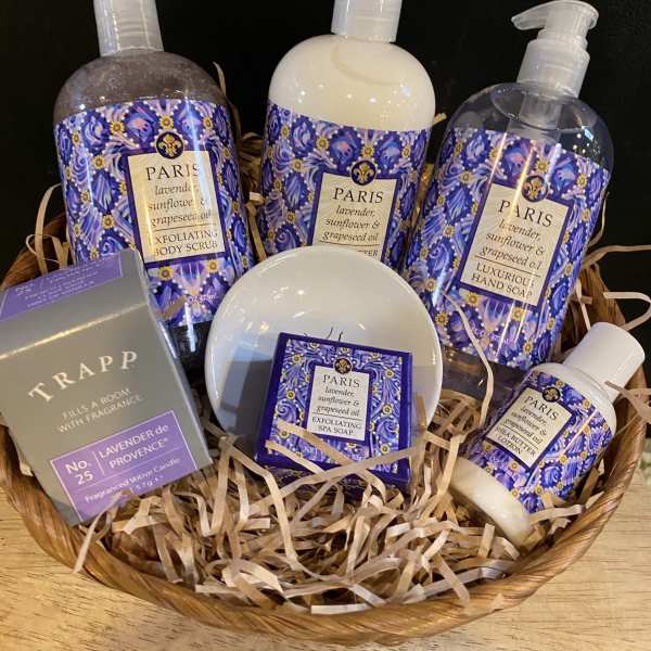 Basket of lavender-scented bath and body products with purple packaging