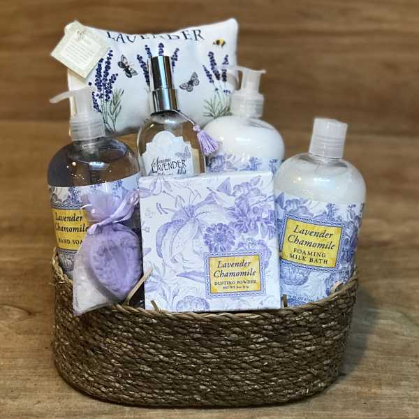 Lavender chamomile bath gift basket with bottles, soap, and a sachet