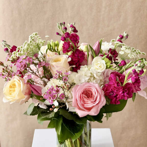 Pink and white mixed flower bouquet in a clear glass vase