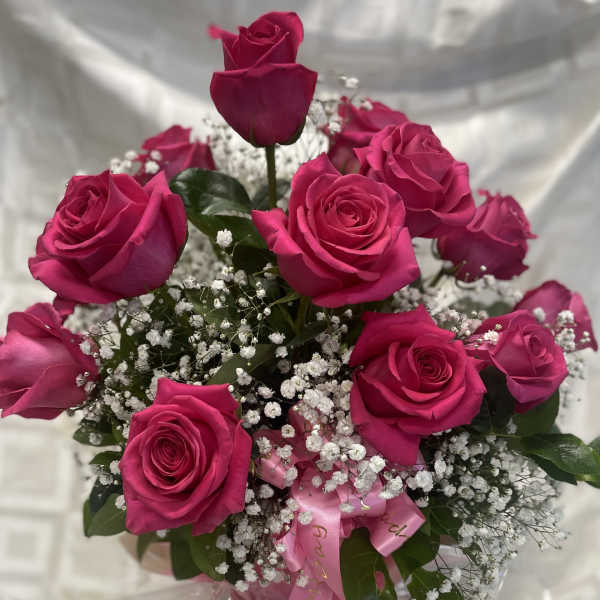 Bouquet of hot pink roses with baby's breath and a pink ribbon