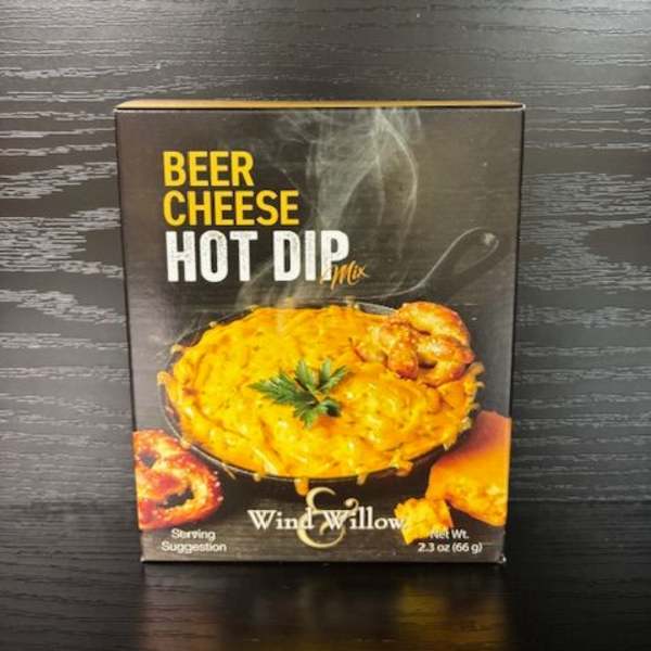 Box of beer cheese hot dip mix on a dark wood surface