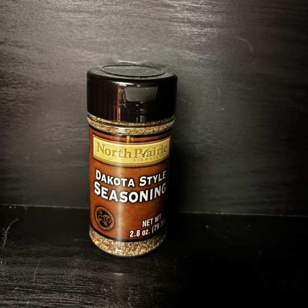 Bottle of Dakota Style seasoning on a dark surface