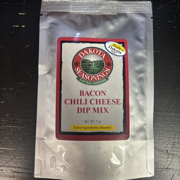 Packet of bacon chili cheese dip mix in a silver pouch